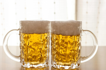 ビールジョッキに入れたビールのイメージ
