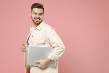 Young copywriter happy successful freelancer caucasian man 20s wearing jacket white t-shirt hold...