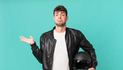 motorbike rider feeling puzzled and confused, doubting, weighting or choosing different options...