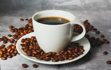 Hot black coffee for morning beverage menu in white ceramic cup with coffee beans.