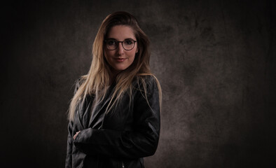 Attractive young woman poses for the camera - studio photography