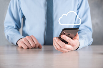 Businessman hand holding cloud.Cloud computing concept, close up of young business man with cloud over his hand.The concept of cloud service.