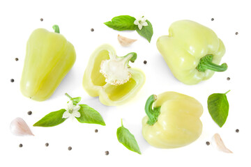 Top view of sweet fresh white bell pepper with leaves and flowers , garlic and peppercorns isolated on white background