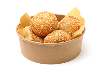 Golden fried dessert balls covered with sesame on white background
