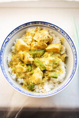 Green thai chicken curry with peas and lemon grass, rice 