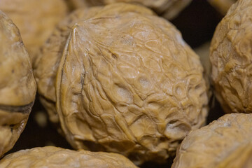 Fototapeta premium close up of a hard shelled brown wallnuts 