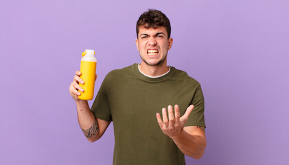 man with smoothy looking angry, annoyed and frustrated screaming wtf or what’s wrong with you