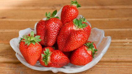 Cup full of red strawberries