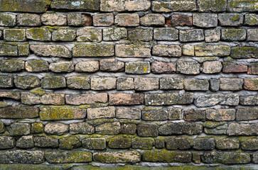 Old wall full of dirty bricks