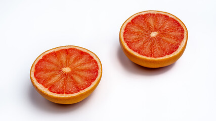 Two grapefruit slices whit shite background