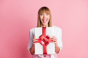 Photo of young excited woman happy positive smile get gift present box holiday isolated over pastel color background