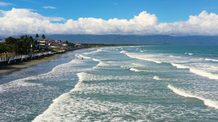 Fototapeta na wymiar The coast with hotels and tourists, a famous place for surfing in the Philippines, top view. Secret Surf Capital Of The Philippines. Sabang Beach, Baler, Aurora, Philippines.