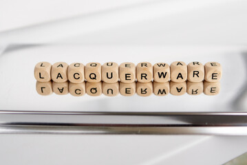 Word lacquerware made by wooden cubes with reflection