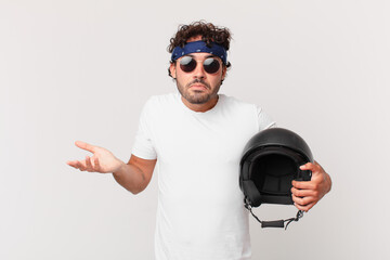 motorbike rider feeling puzzled and confused, doubting, weighting or choosing different options...