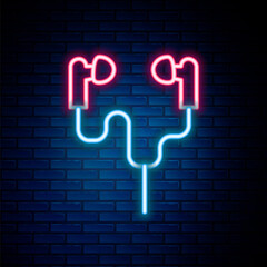 Glowing neon line Air headphones icon icon isolated on brick wall background. Holder wireless in case earphones garniture electronic gadget. Colorful outline concept. Vector