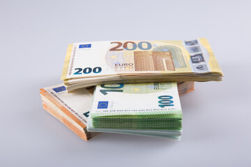 Stack of banknotes on a white background.
