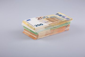 Stack of banknotes on a white background.
