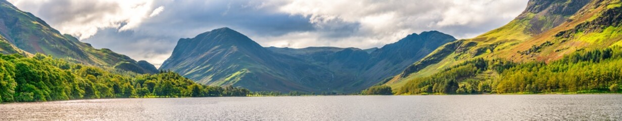 Buttermere lake panorama overlooking Haystacks peak in Lake District. Cumbria, England - obrazy, fototapety, plakaty
