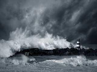 Fototapeta na wymiar Stormy waves against beacon