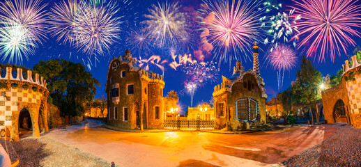 Beautiful fireworks show in Barcelona seen from Park Guell. Park was built from 1900 to 1914 and...