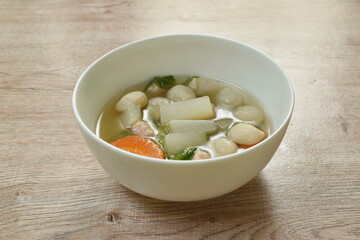 boiled radish with fish ball and mashed pork soup on bowl
