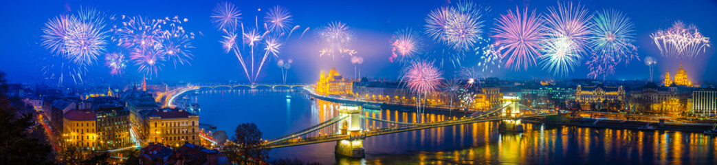 Naklejka na ściany i meble Fireworks in Budapest. New year celebration. Skyline panorama of the city