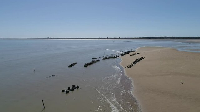Oyster and mussel cage pouch markers at the coastline of Boyardville in Oleron island France, Aerial orbit around shot