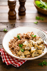 Mushroom buckwheat porridge bowl with fresh parsley