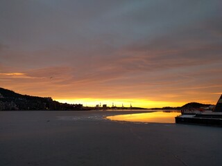 sunset by the docks in the city in the winter