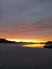 sunset by the docks in the city in the winter