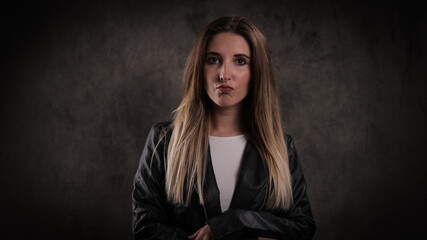 Close-up shot of a young attractive woman in her mid 20s - studio photography