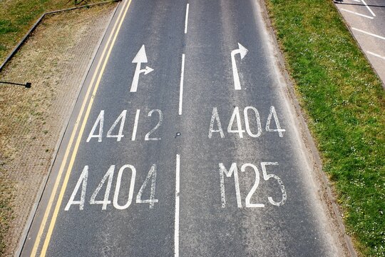 Road surface signs for the A412, A404 and M25 in Rickmansworth, Hertfordshire, UK
