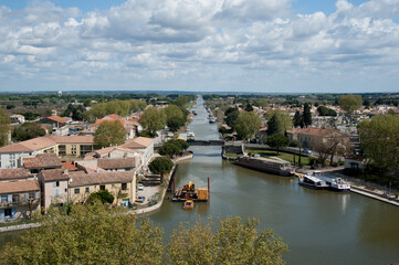 Obraz premium Aigues-Mortes France. The port city of Aigues-Mortes. Yachts moored off the coast. The maritime channel flows into the Mediterranean Sea. The concept of historical and photographic tourism