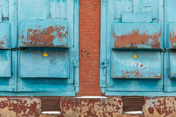 Doors and gates of an electrical substation. Blue gate. 