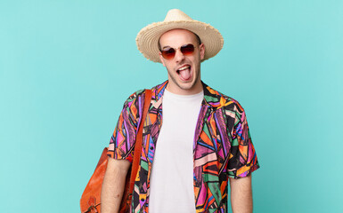 tourist man with cheerful, carefree, rebellious attitude, joking and sticking tongue out, having fun