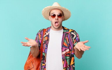 tourist man open-mouthed and amazed, shocked and astonished with an unbelievable surprise