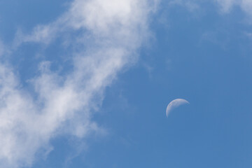 The white crescent moon in the afternoon cool white clouds on beautiful afternoon sky background Images for clear sky background design make you feel fresh and airy.