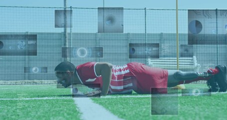 Animation of scopes and data processing over male football player with prosthetic leg doing push ups - Powered by Adobe