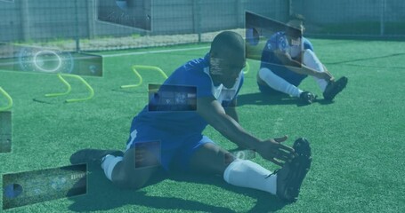 Animation of scopes and data processing on screens over male football player stretching - Powered by Adobe