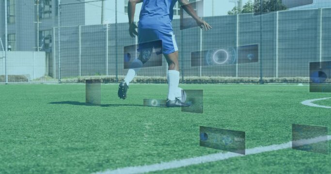 Animation of scopes and data processing on screens over male football player running with ball