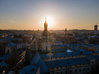 aerial view of sunset above old european city. church bell tower
