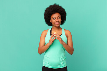 black afro woman scheming and conspiring, thinking devious tricks and cheats, cunning and betraying