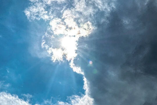  Light of the setting sun through the clouds