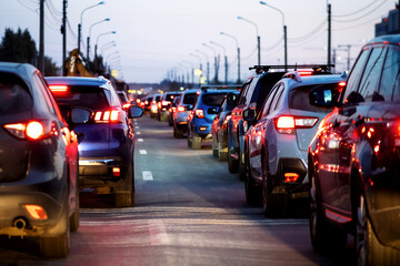 Background, blur, out of focus, bokeh. Traffic jams, road repairs, or accidents. Red brake lights of stopped cars.