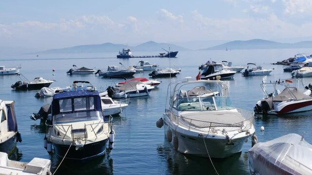 Motor boats at Kadikoy Suadiye coast and The Princes Islands landscape