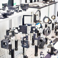 Brackets and rails for optical