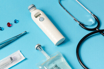A close-up view of a medical instruments lying on a blue background