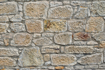 Close Up of Rough Textured Stone in Old Masonry Wall 