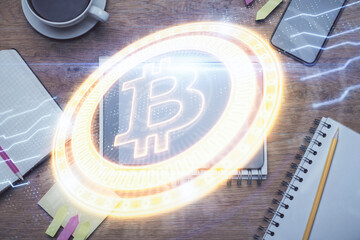 Double exposure of blockchain theme hologram over table with phone. Top view. Crypto technology concept.