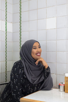 Black Muslim Woman in cafe